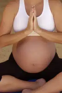 Pregnant woman doing yoga pose